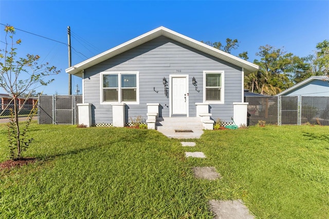 view of front of property with a front lawn and a fenced backyard