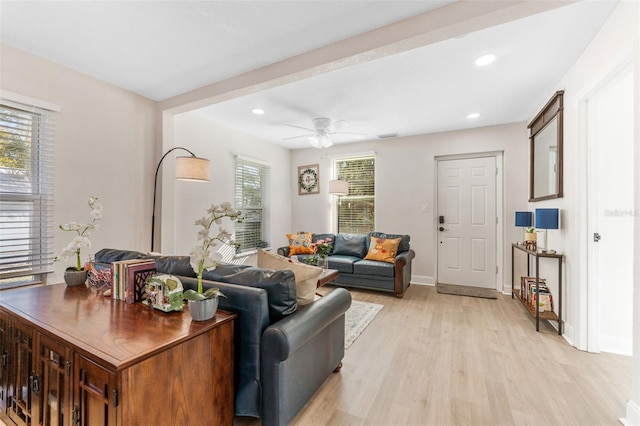 living room with baseboards, recessed lighting, ceiling fan, and light wood-style flooring