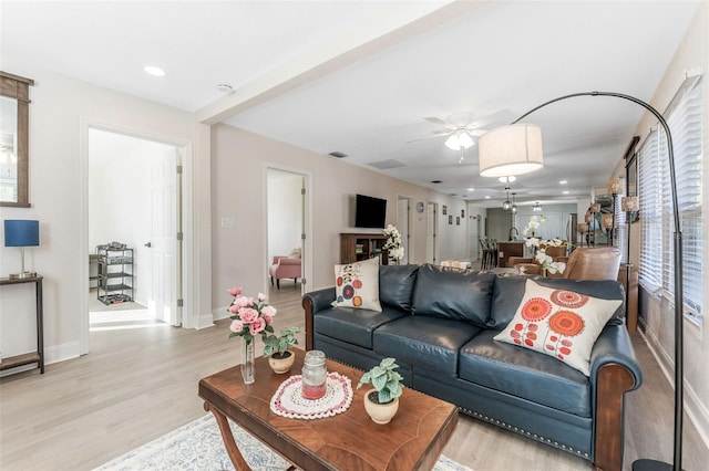 living area with recessed lighting, ceiling fan, baseboards, and light wood-type flooring