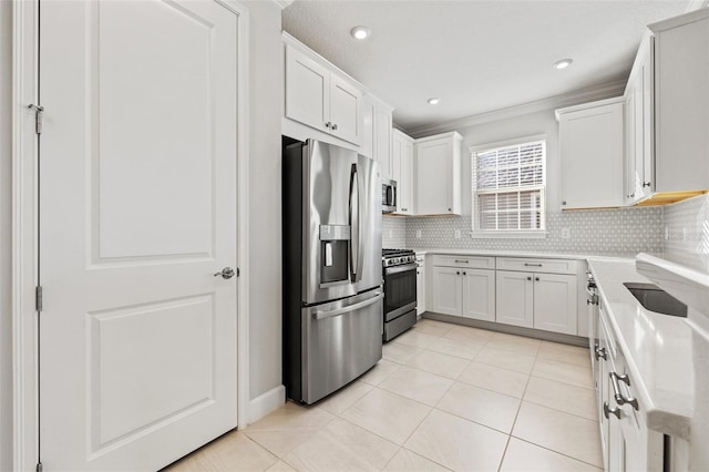 kitchen featuring white cabinets, light tile patterned floors, backsplash, and stainless steel appliances