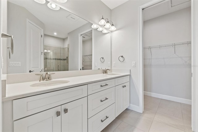 bathroom with vanity, tile patterned floors, and an enclosed shower