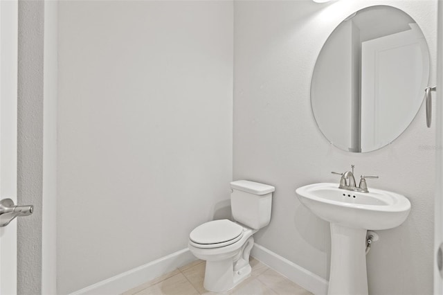 bathroom featuring tile patterned floors and toilet