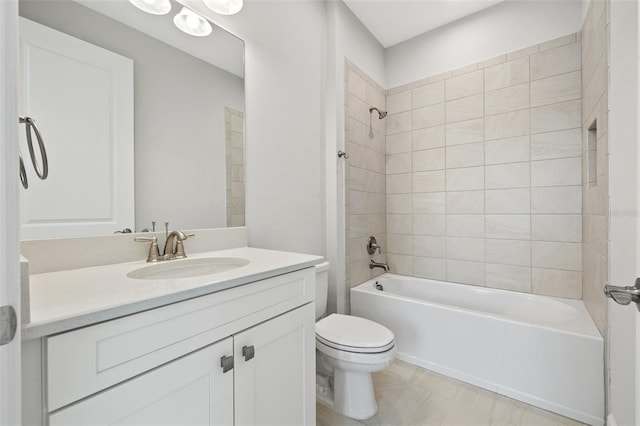 full bathroom with vanity, toilet, and tiled shower / bath