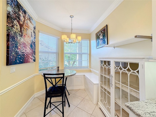 dining space featuring ornamental molding, light tile patterned floors, and a chandelier