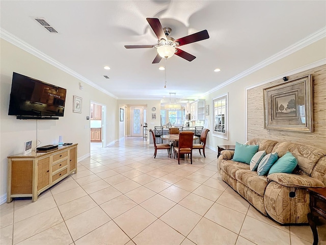 tiled living room with crown molding and ceiling fan