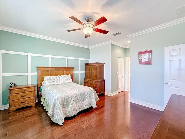 bedroom with a closet, ceiling fan, crown molding, and dark wood-type flooring