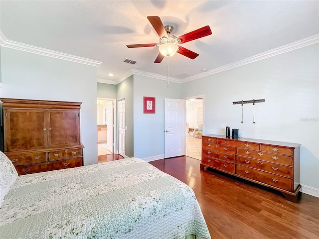 bedroom featuring crown molding, ceiling fan, connected bathroom, dark hardwood / wood-style flooring, and a closet