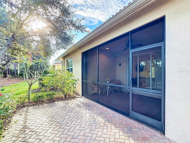 view of patio / terrace with a sunroom