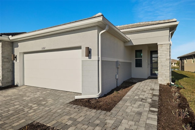 view of side of property with a garage