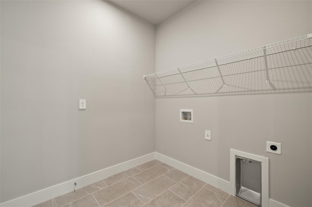 washroom with hookup for a washing machine, hookup for an electric dryer, and light tile patterned floors