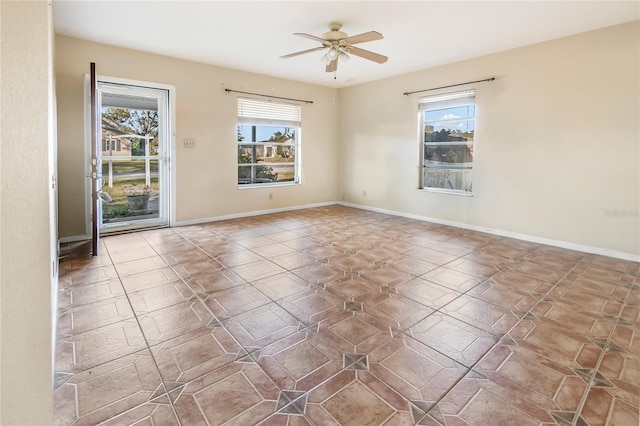 spare room with ceiling fan