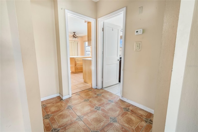 hallway with light tile patterned floors