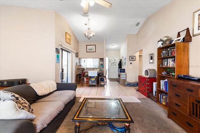 living room featuring light tile patterned floors, ceiling fan with notable chandelier, and high vaulted ceiling