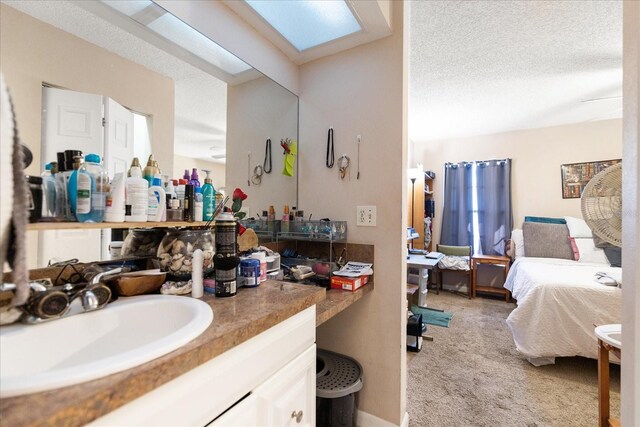 bathroom featuring vanity and a textured ceiling