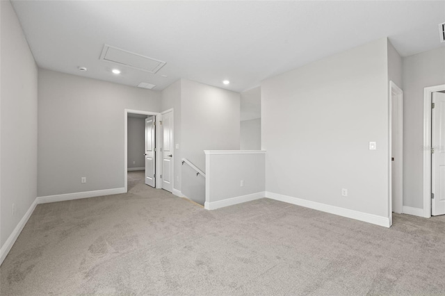 spare room featuring recessed lighting, visible vents, baseboards, and light colored carpet