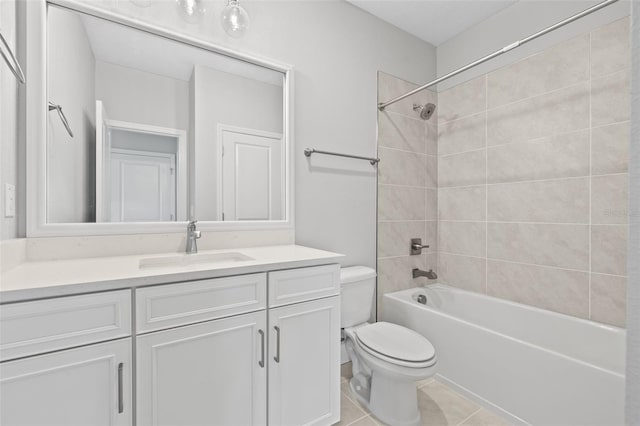 bathroom featuring toilet, shower / bathing tub combination, vanity, and tile patterned floors