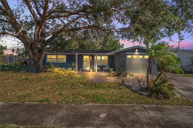 single story home featuring a garage