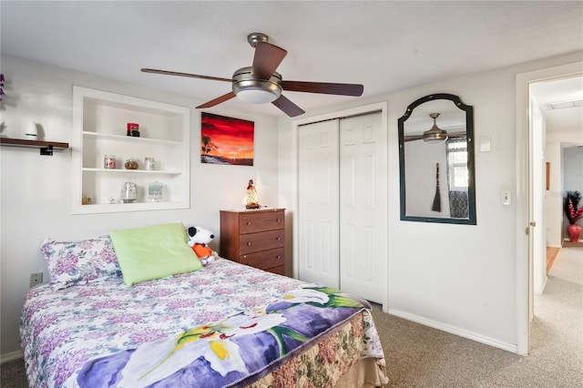 carpeted bedroom featuring ceiling fan and a closet