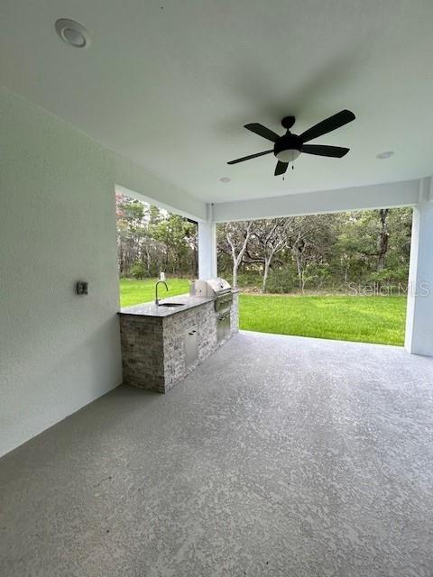 13400 Haflinger Way, Hudson, FL 34667 - view of patio / terrace featuring area for grilling and a ceiling fan