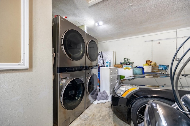 laundry area featuring a textured ceiling and stacked washer and clothes dryer