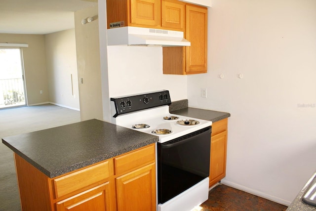 kitchen with electric stove and dark colored carpet