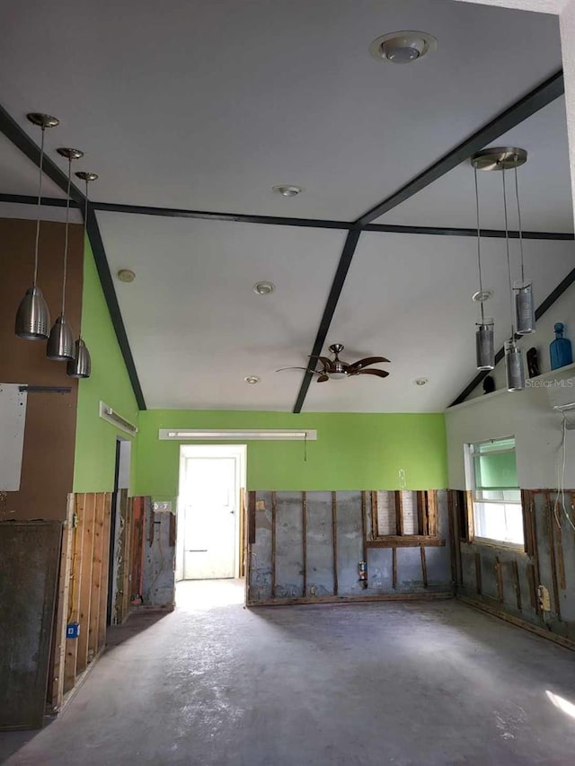 miscellaneous room featuring a wealth of natural light, ceiling fan, and concrete floors