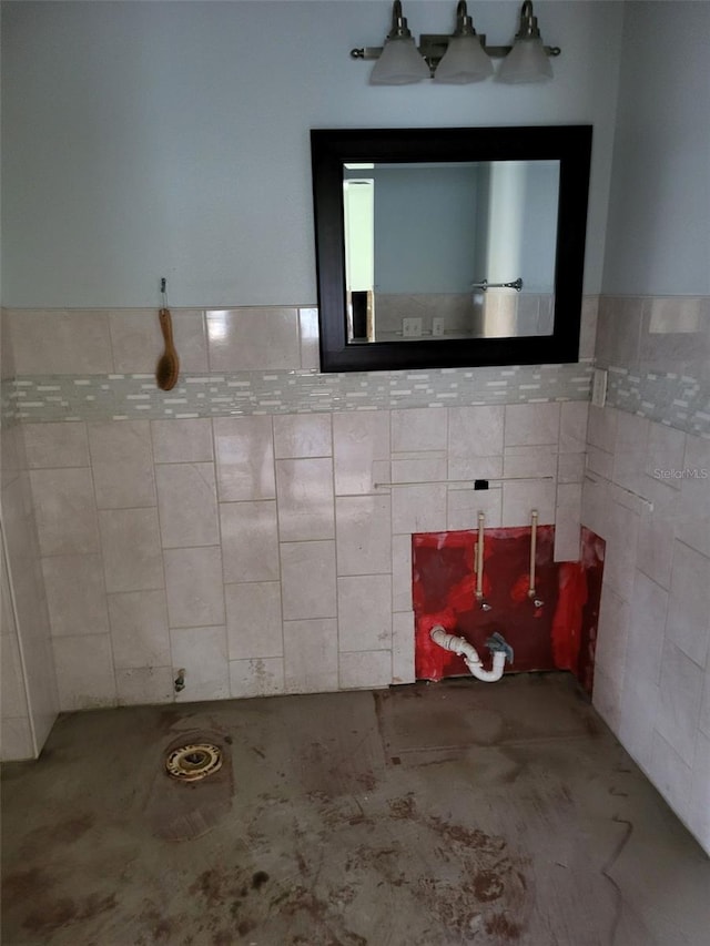 bathroom with tile walls