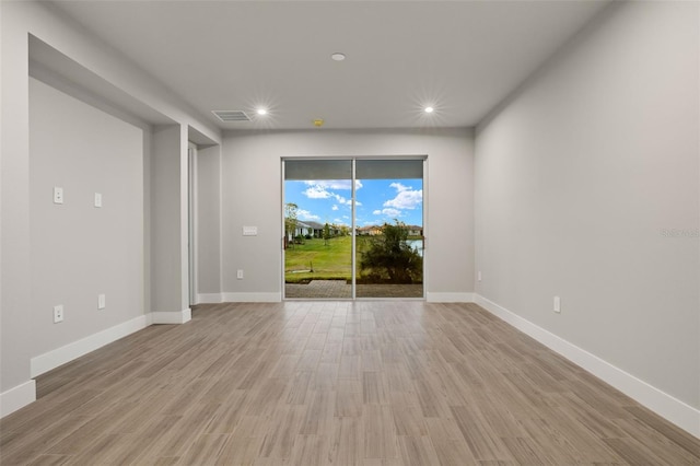 unfurnished room featuring light wood-type flooring