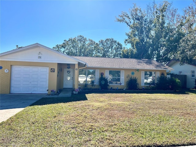 ranch-style home with a front yard and a garage