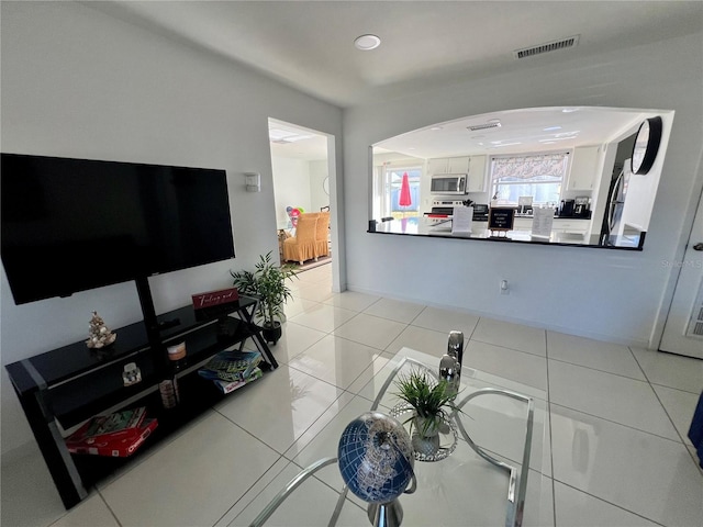 living room with light tile patterned floors