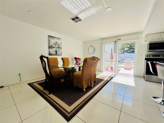 dining space with tile patterned flooring