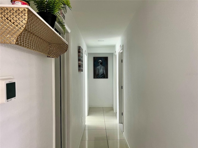 corridor with light tile patterned floors