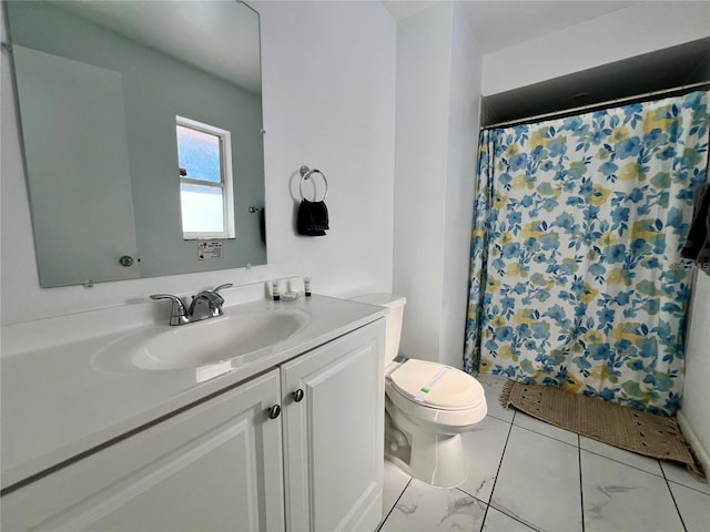 bathroom with vanity, a shower with shower curtain, and toilet