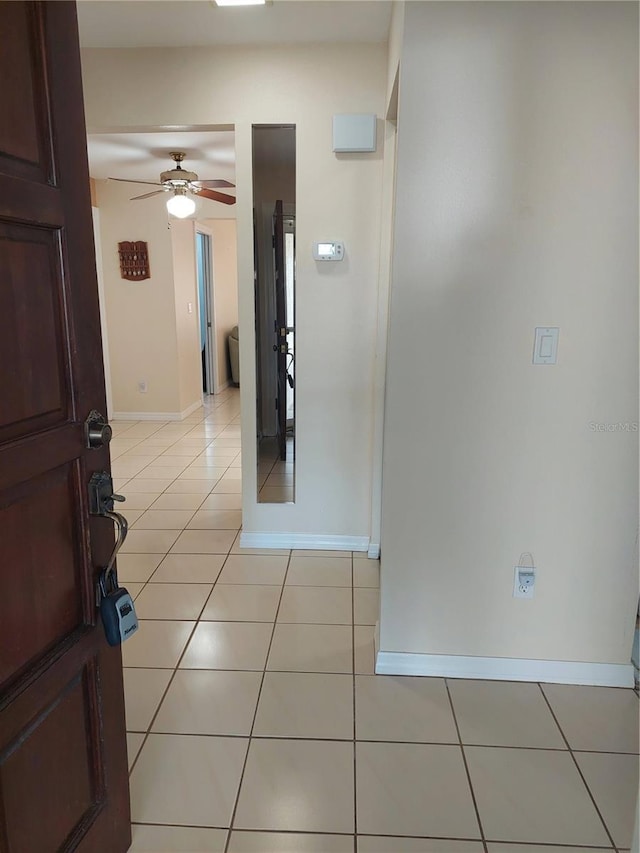 corridor with light tile patterned floors