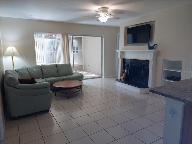 living room featuring ceiling fan and light tile patterned floors