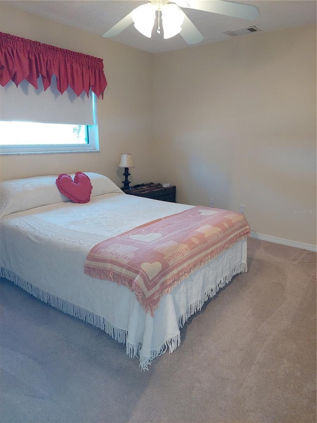 bedroom featuring ceiling fan and carpet floors