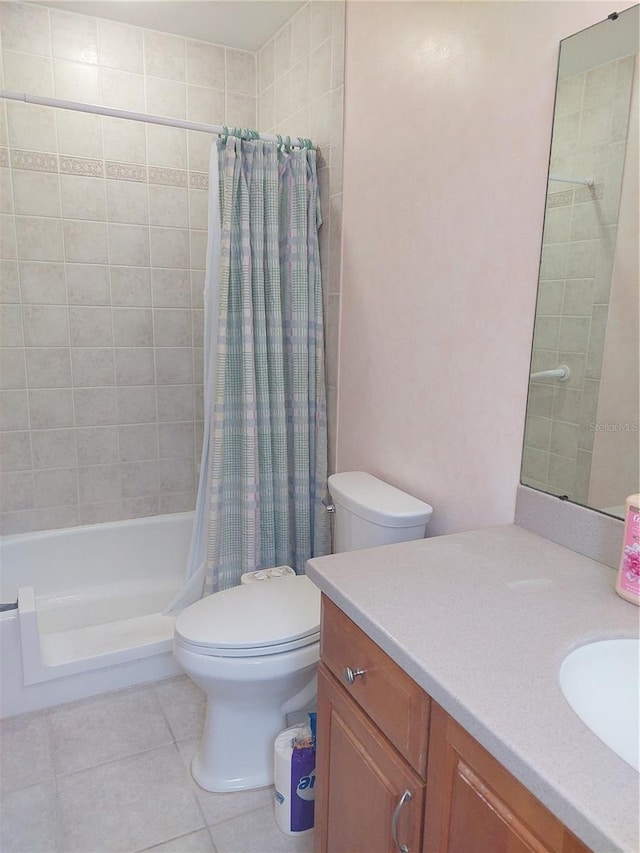 full bathroom with tile patterned floors, vanity, shower / bath combination with curtain, and toilet