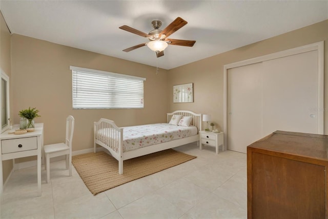 bedroom featuring ceiling fan and light tile patterned floors