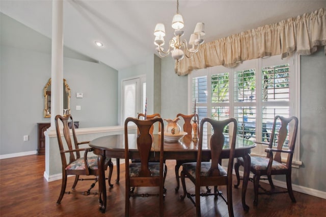 dining area with dark hardwood / wood-style flooring, lofted ceiling, a wealth of natural light, and a chandelier