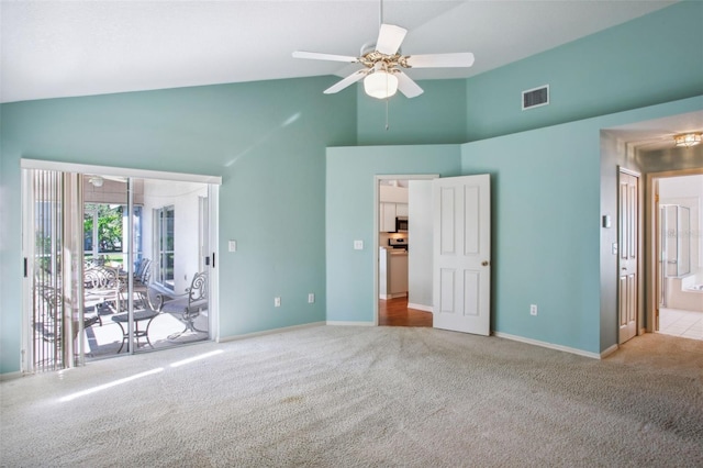 unfurnished bedroom featuring access to exterior, ensuite bath, light colored carpet, ceiling fan, and high vaulted ceiling