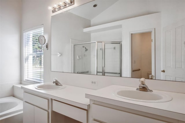 full bathroom with vanity, independent shower and bath, vaulted ceiling, and toilet