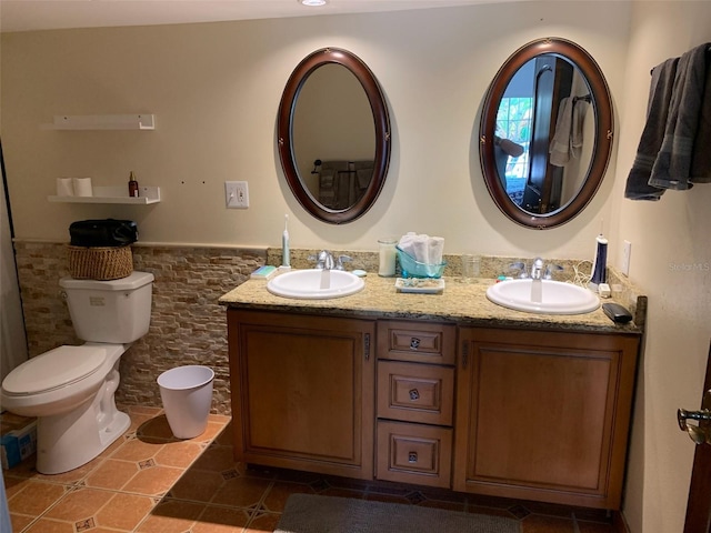 bathroom featuring tile patterned floors, vanity, and toilet