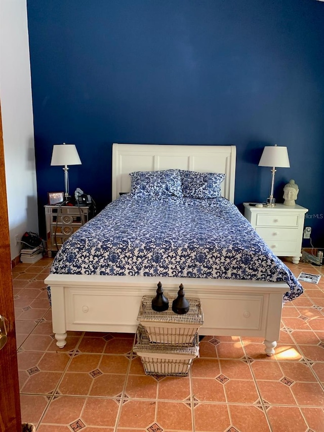 bedroom featuring tile patterned flooring