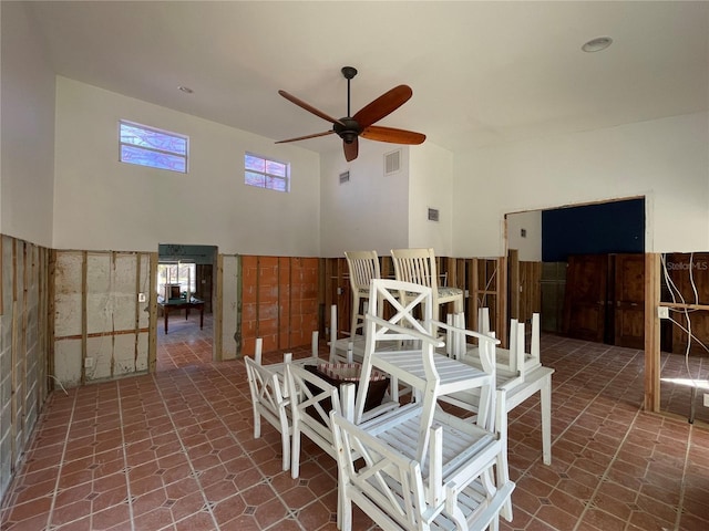 interior space with ceiling fan