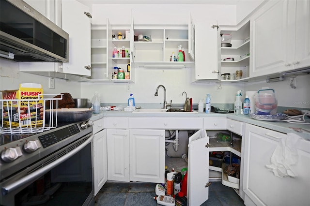 353 144th Ave, Madeira Beach, FL 33708 - kitchen with stainless steel appliances, open shelves, a sink, and white cabinetry