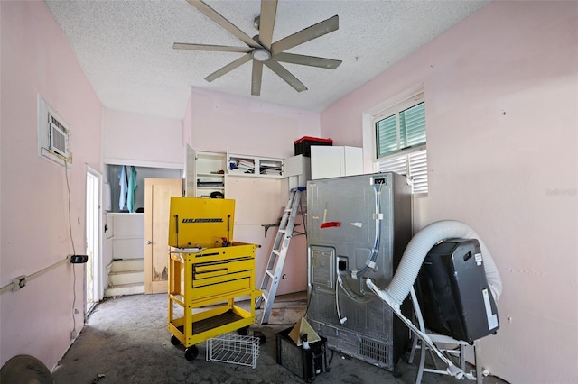 353 144th Ave, Madeira Beach, FL 33708 - garage with ceiling fan and a wall mounted AC