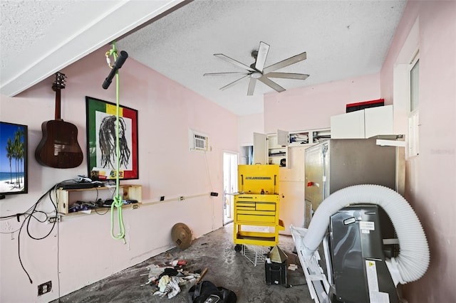 kitchen with white cabinets, ceiling fan, a textured ceiling, and concrete floors