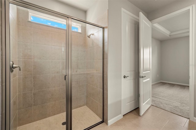 bathroom featuring a shower with shower door and tile patterned flooring