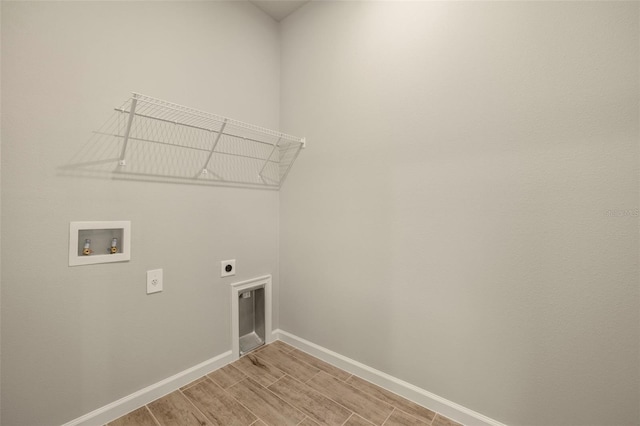 laundry area featuring washer hookup, hookup for an electric dryer, and light wood-type flooring