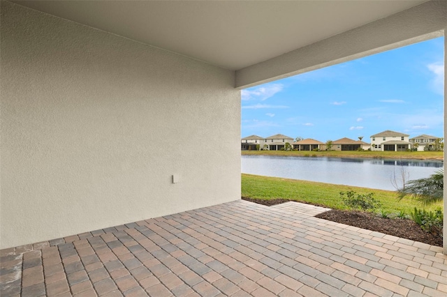 view of patio featuring a water view